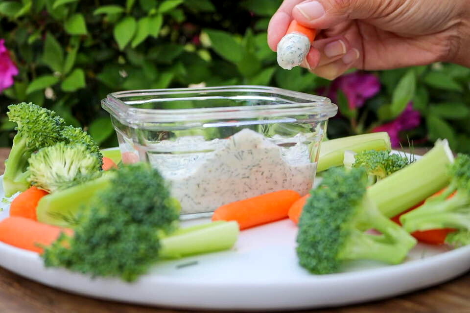 Dipping a carrot into the dip