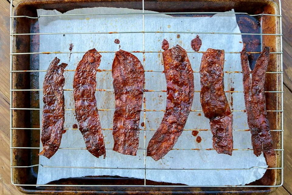 Plant based bacon on a wire rack